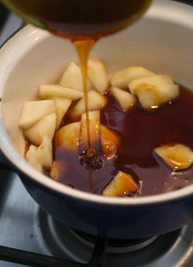 Pears brewing in caramel